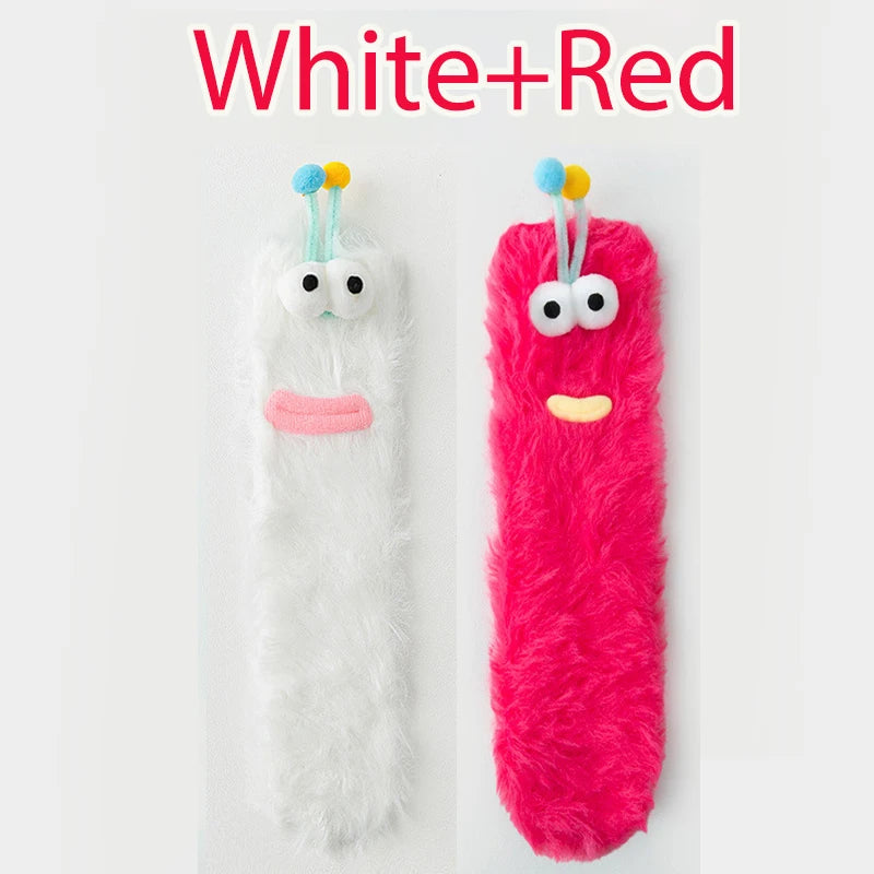 Funny monster fleece winter socks in white and red, featuring adorable monster designs for warmth and comfort.