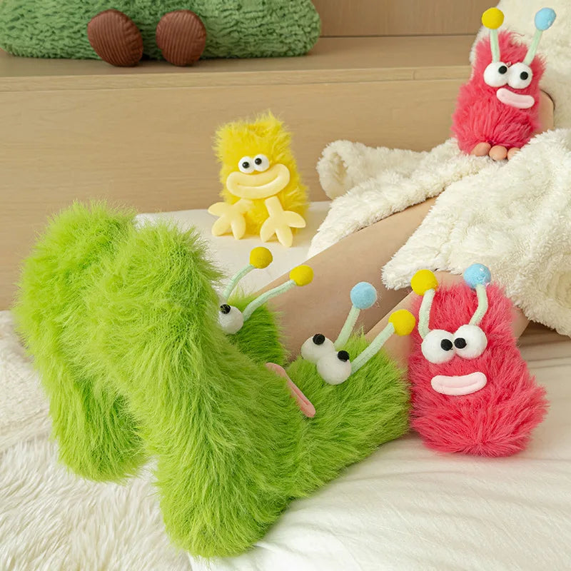 Funny monster fleece winter socks in bright green and red, featuring cute monster designs for cozy lounging.