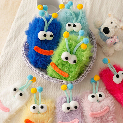 Funny monster fleece winter socks in assorted colors, featuring cute monster faces and fuzzy textures for cozy warmth.