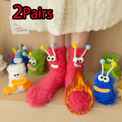 Funny monster fleece winter socks on feet, surrounded by colorful plush monster toys, showcasing cozy and playful design.